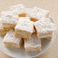 Salted Caramel Swirl Marshmallows stacked on a white pedestal