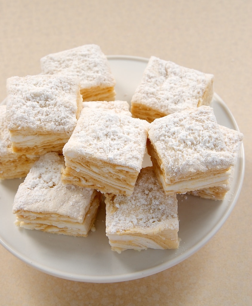 Salted Caramel Swirl Marshmallows stacked on a white pedestal