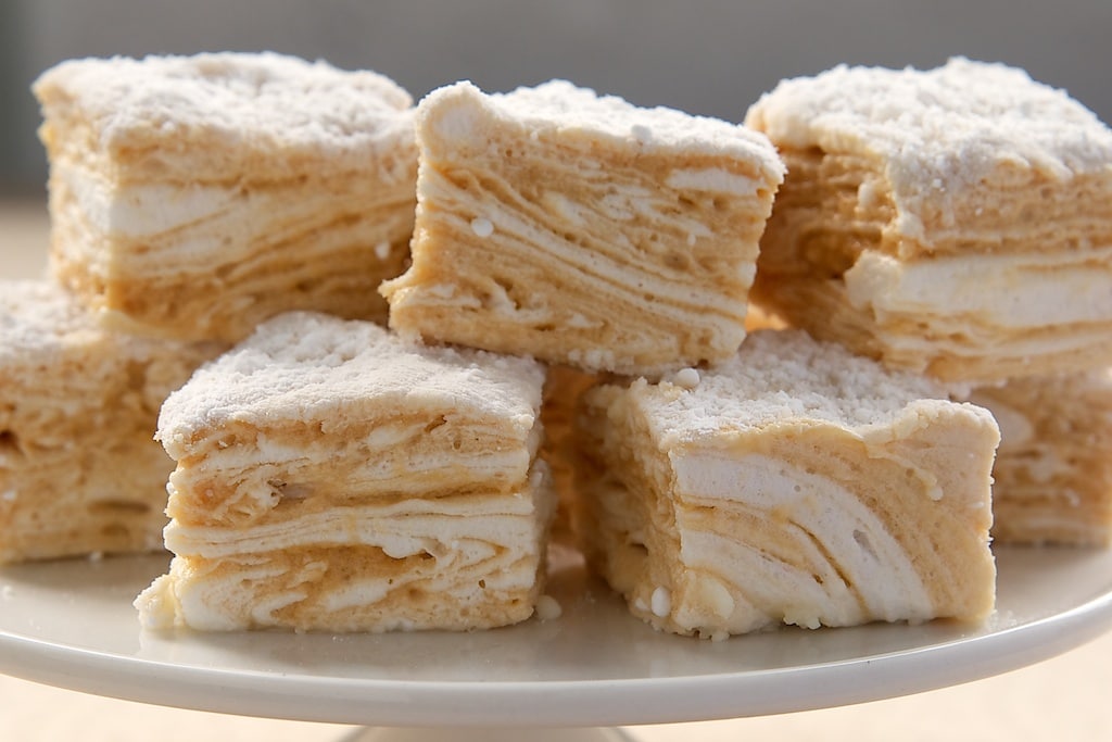 Salted Caramel Swirl Marshmallows on a white pedestal