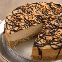 Rich peanut butter cheesecake tops off a salty pretzel crust in this delicious cheesecake. A sweet and salty dream!