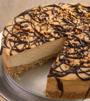 Rich peanut butter cheesecake tops off a salty pretzel crust in this delicious cheesecake. A sweet and salty dream!