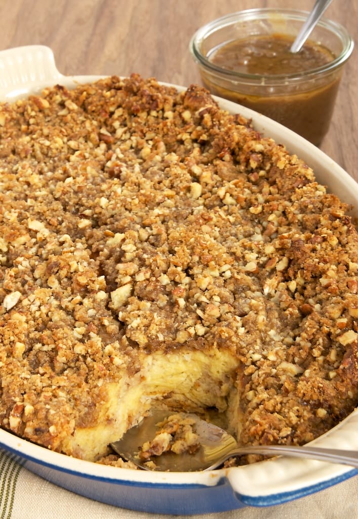 Praline Bread Pudding with Caramel-Pecan Sauce is full of pecans, brown sugar, and a bit of cinnamon. Then, it's topped with a sweet, nutty caramel sauce. Delicious! - Bake or Break