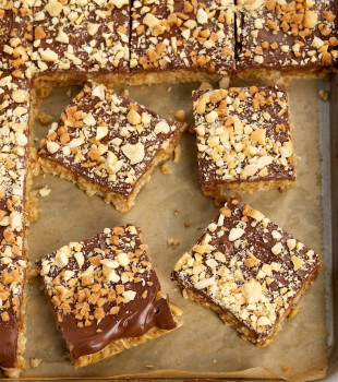 Peanut Butter-Chocolate-Oatmeal Cereal Bars on a parchment-lined baking sheet
