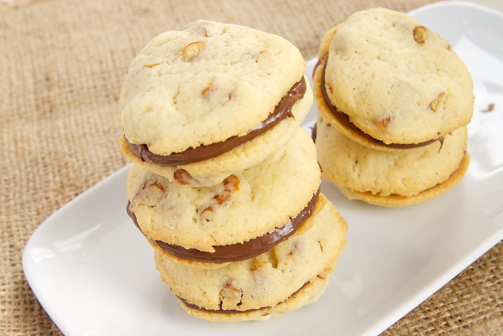 Pretzel Cookies with Chocolate-Hazelnut Filling are sweet, salty, pretzel-filled cookies filled with your favorite chocolate-hazelnut spread. - Bake or Break