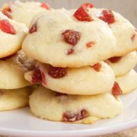 Strawberry Cream Cheese Cookies stacked on a white serving stand