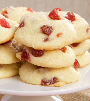 Strawberry Cream Cheese Cookies stacked on a white serving stand