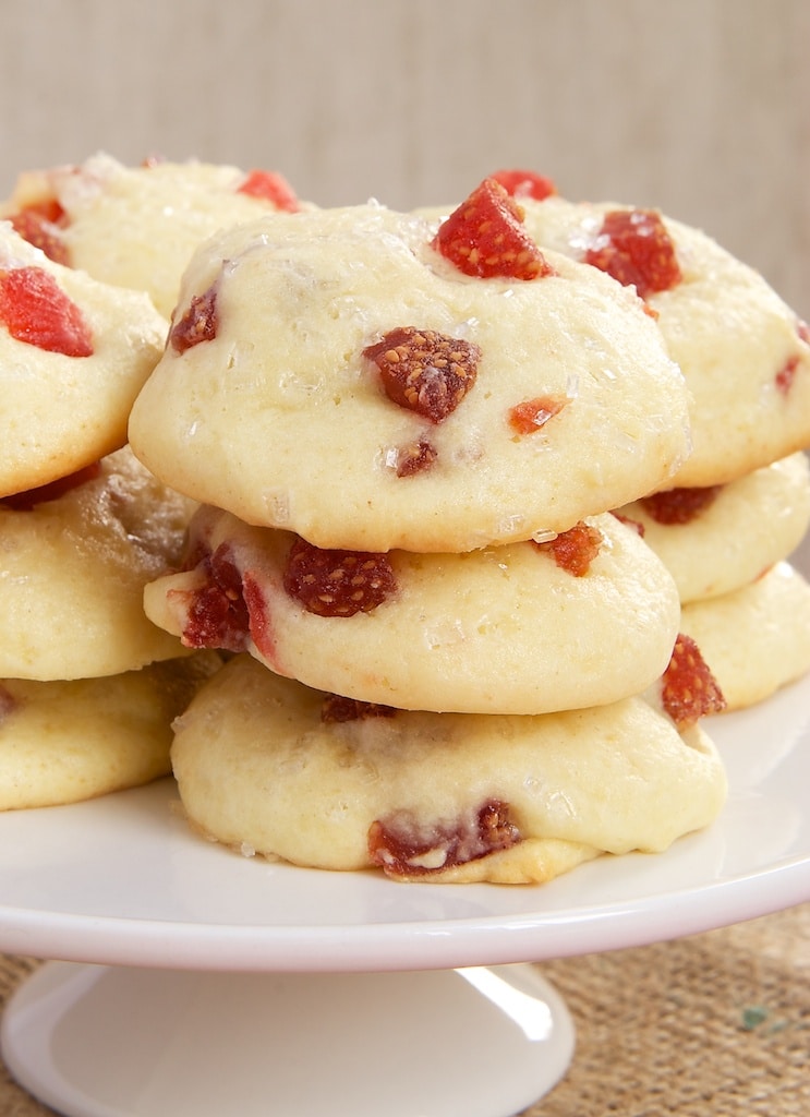 Strawberry Cream Cheese Cookies stacked on a white serving stand