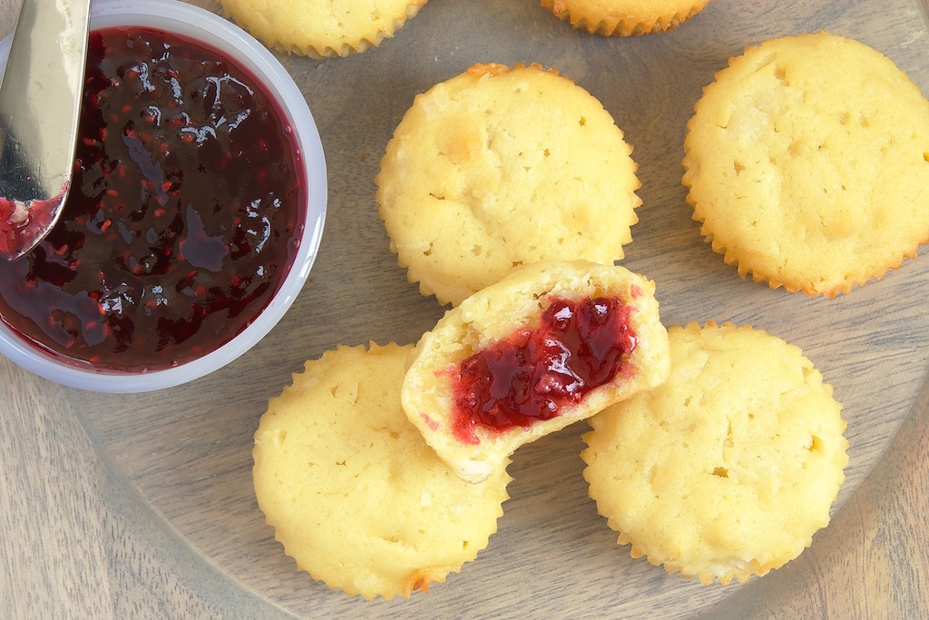 overhead view of Mini Coconut Pound Cakes on a wooden tray