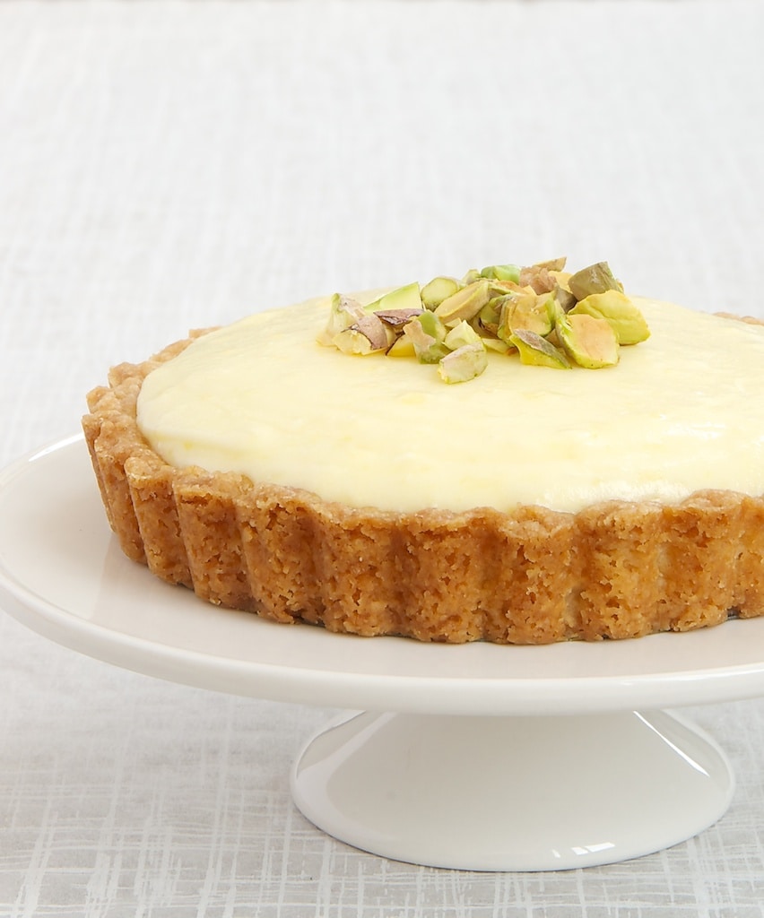 Lemon Cream Tart on a white pedestal