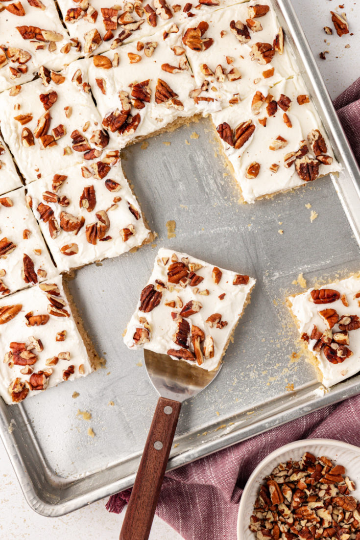 Sliced brown butter Texas sheet cake in pan