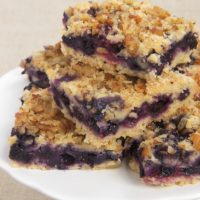 Berry Crumb Bars combine fresh berries with a soft crust and a nutty crumb topping.