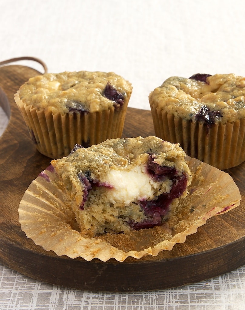 Cherry Cheesecake Muffins on a wooden serving plate