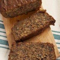 sliced Chai Caramel Banana Bread on a wooden cutting board