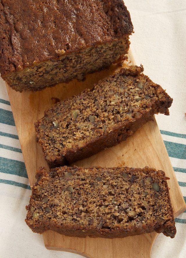 sliced Chai Caramel Banana Bread on a wooden cutting board