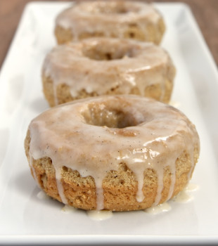 These baked doughnuts are flavored with lots of delicious spices and topped with a sweet vanilla glaze.