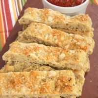 Italian Herb and Cheese Breadsticks are so simple to make with Krusteaz Flatbreads mixes! Serve with your favorite marinara for a great snack.