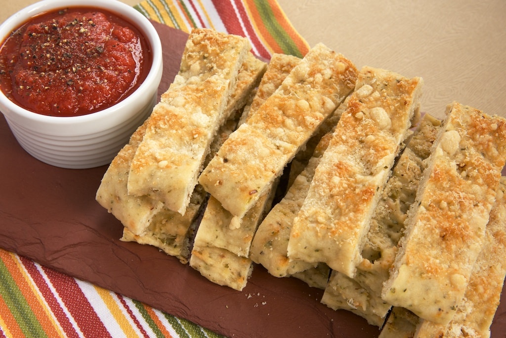 Italian Herb and Cheese Breadsticks are so simple to make with Krusteaz Flatbreads mixes! Serve with your favorite marinara for a great snack.