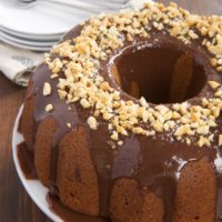 Peanut Butter Bundt Cake with Milk Chocolate Ganache is a must for fans of chocolate and peanut butter. This simple cake is as delicious as it is gorgeous! - Bake or Break