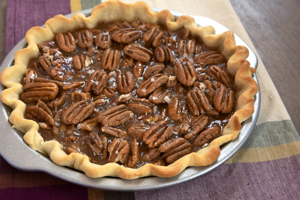 Rich, gooey, salty caramel and crunchy pecans make for a delicious, irresistible dessert. This Salted Caramel Pecan Pie is sure to be devoured quickly! - Bake or Break