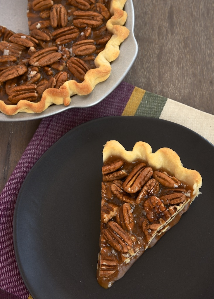 A slice of pecan pie on a plate.