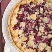 Cranberry Cheesecake Pie on a white cake plate