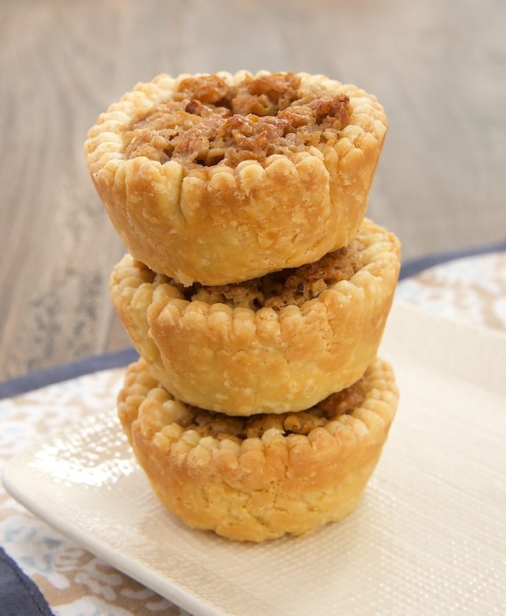 Coconut, crisp rice cereal, and cream cheese provide a delicious twist to pecan pie in these Coconut Pecan Tarts.