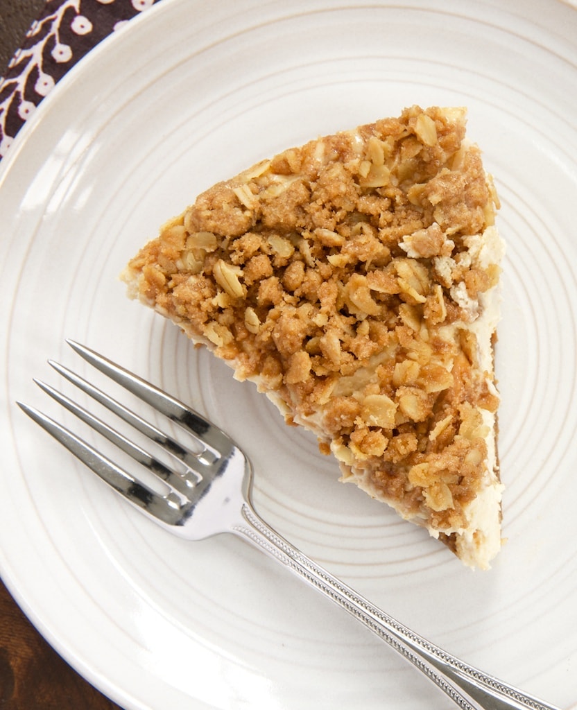 Sweet, cinnamon-y cheesecake is topped with a layer of pear crisp in this delectable Pear Crisp Cheesecake. - Bake or Break