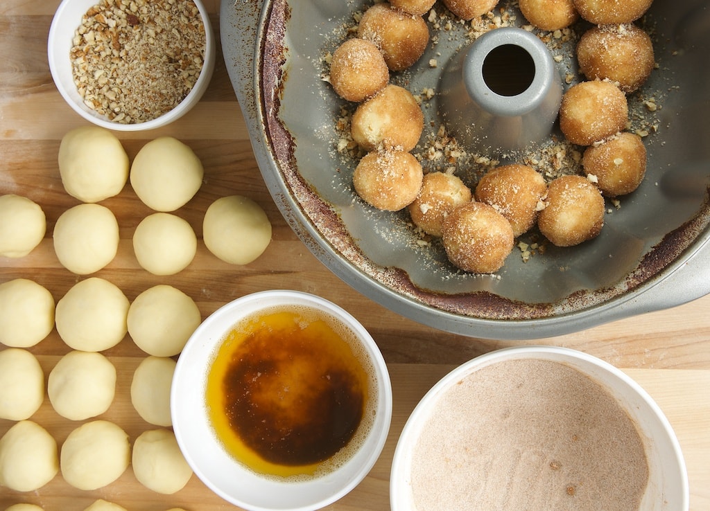 Process of assembling Brown Butter Cinnamon Pecan Pull Apart Bread