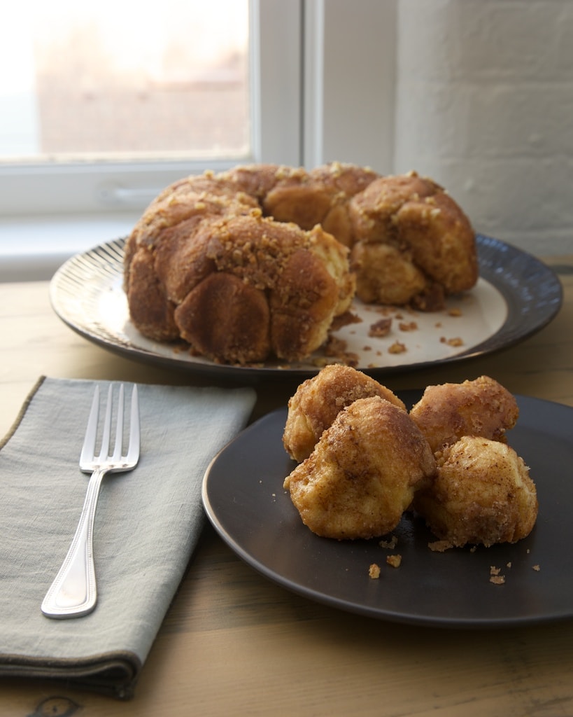 Brown Butter Cinnamon Pecan Pull Apart Bread on plate and serving platter