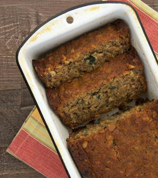 overhead view of Granola Banana Bread in a white metal loaf pan