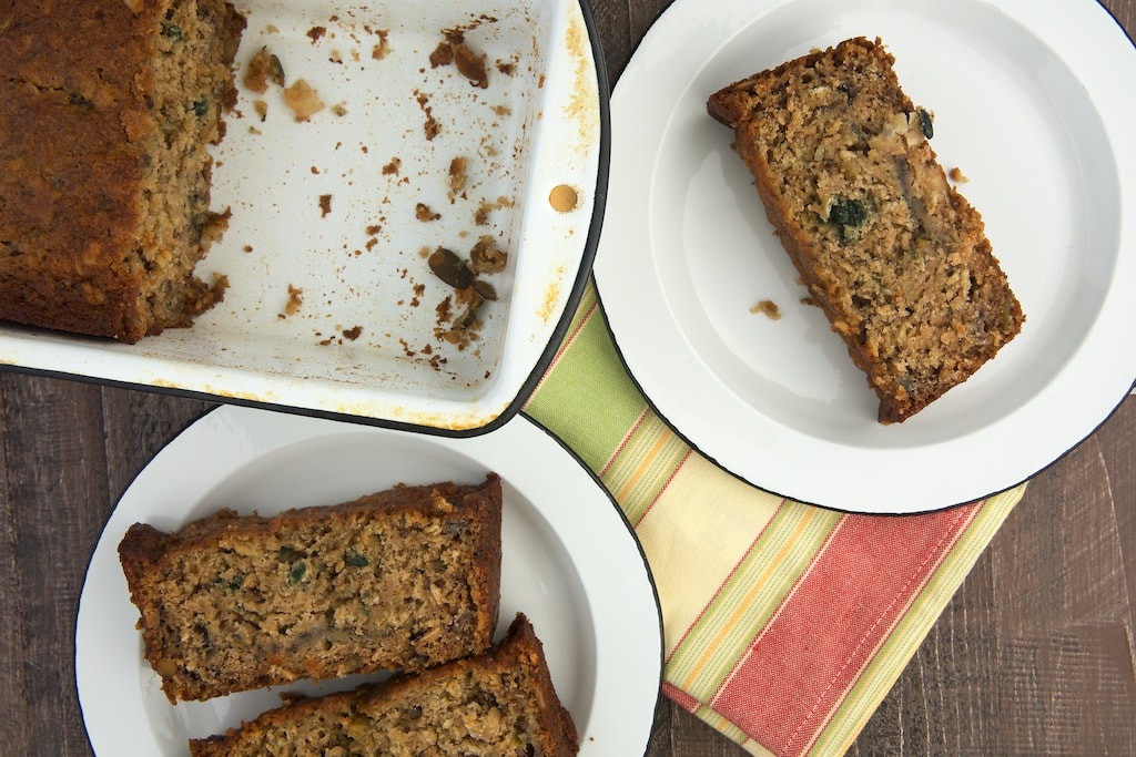 overhead view of slices of Granola Banana Bread on white plates