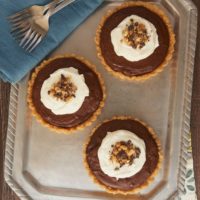 Chocolate peanut butter pudding fills a sweet shortbread crust for a delicious and elegant dessert!