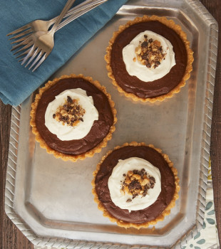 Chocolate peanut butter pudding fills a sweet shortbread crust for a delicious and elegant dessert!