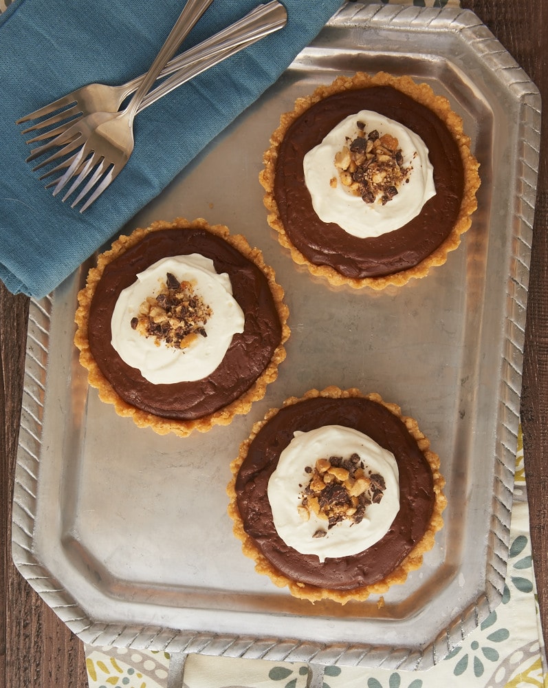 Chocolate peanut butter pudding fills a sweet shortbread crust for a delicious and elegant dessert!