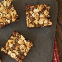 Dulce de Leche Cashew Brownies on a granite board