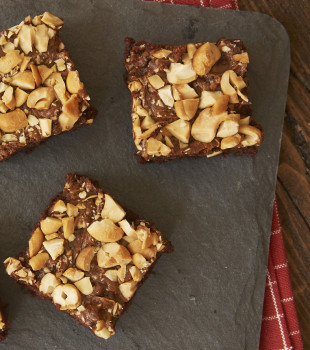 Dulce de Leche Cashew Brownies on a granite board