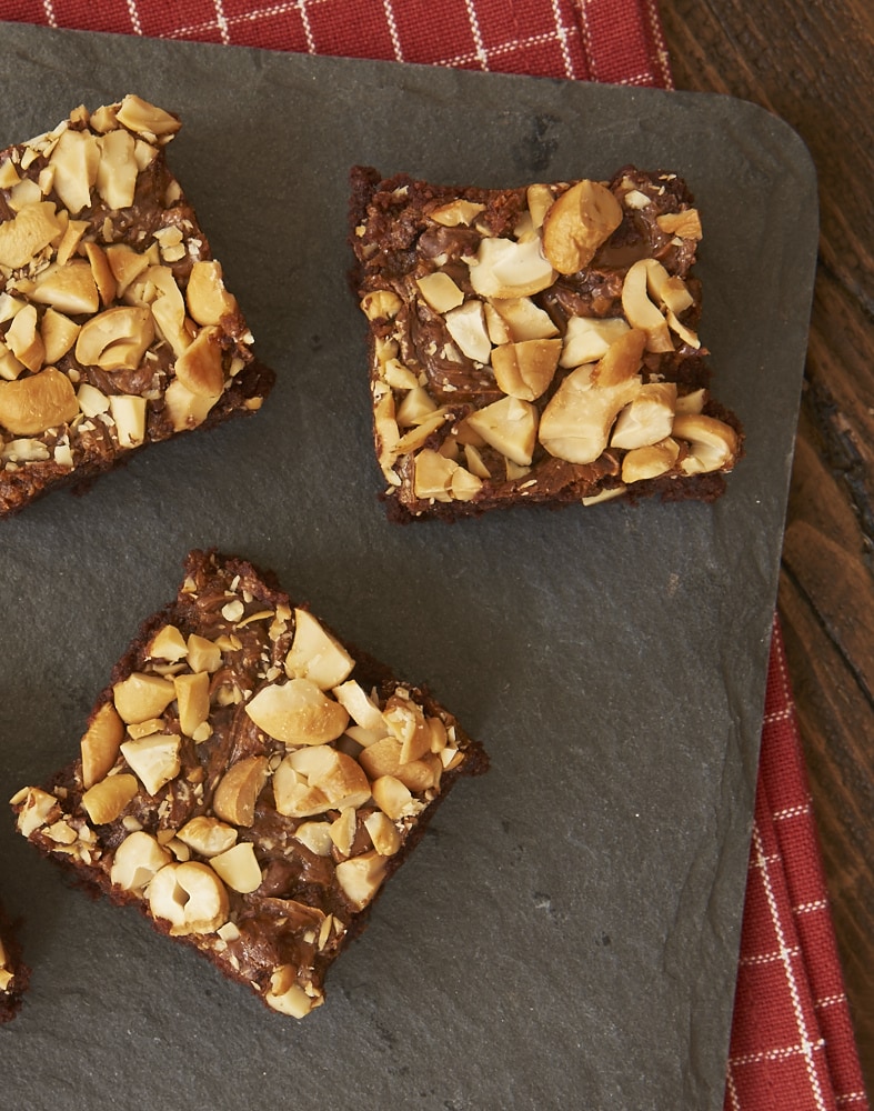 Dulce de Leche Cashew Brownies on a granite board