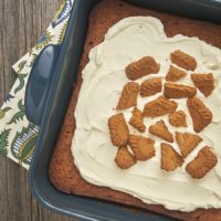 Cookie butter spread and a simple chocolate ganache combine for this flavorful Biscoff Gooey Butter Cake! - Bake or Break