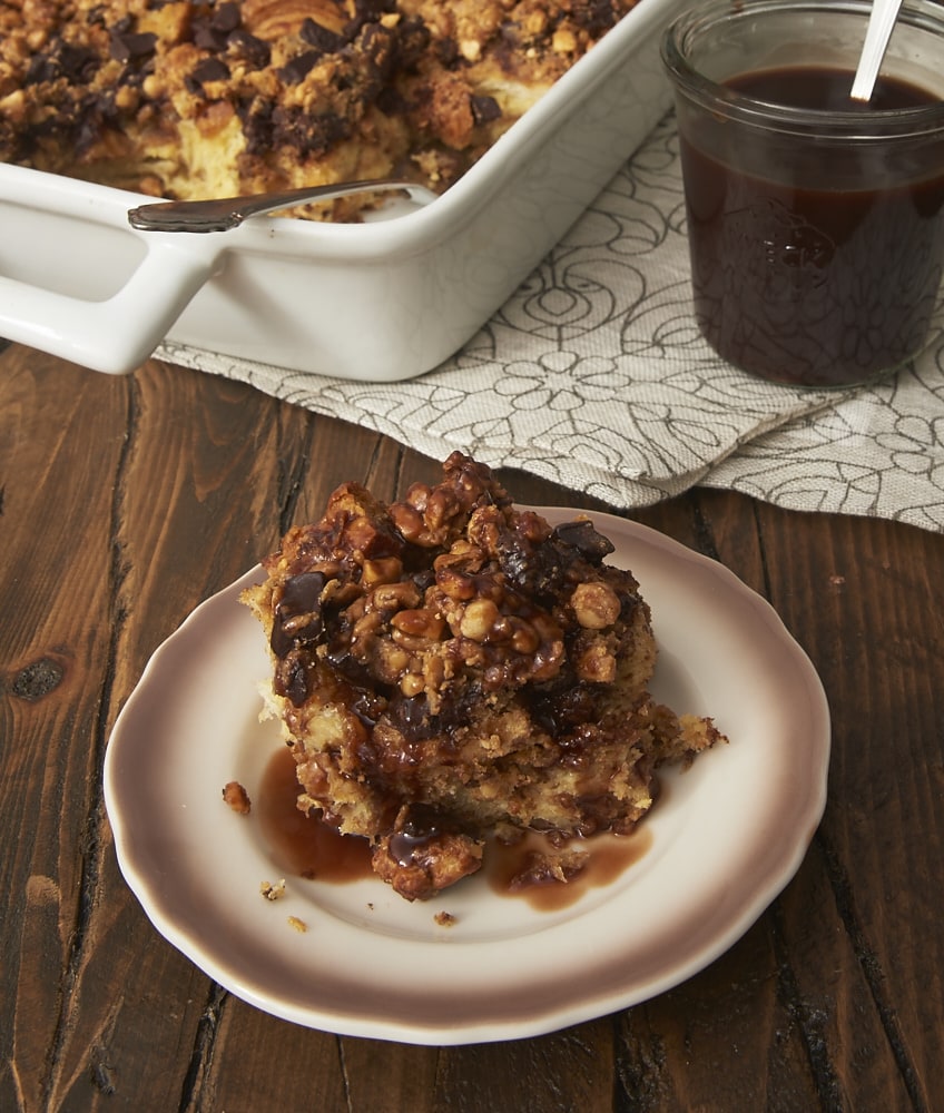 Peanut Butter Chocolate Bread Pudding served on a brown-rimmed white plate