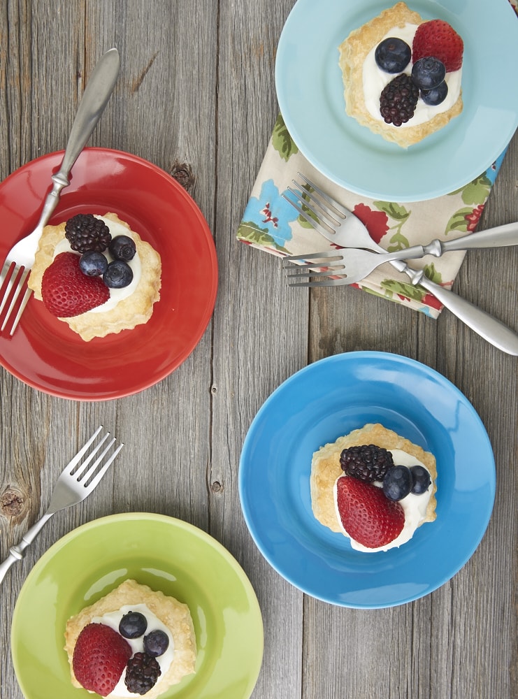 Puff pastry, a creamy filling, and fresh berries come together quickly and simply to make these luscious Berries and Cream Tartlets. - Bake or Break