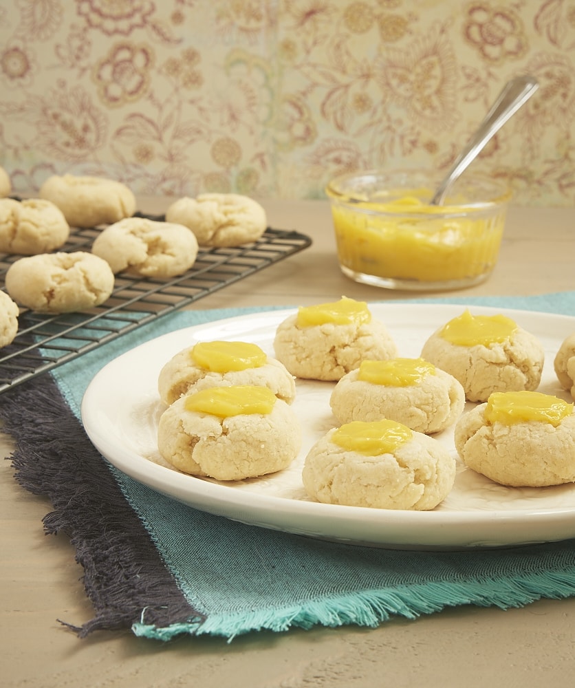 Sweet, tart lemon curd adds a delicious bite to these Lemon Thumbprint Cookies from Bake or Break.