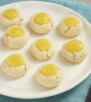 Sweet, tart lemon curd adds a delicious bite to these Lemon Thumbprint Cookies from Bake or Break.