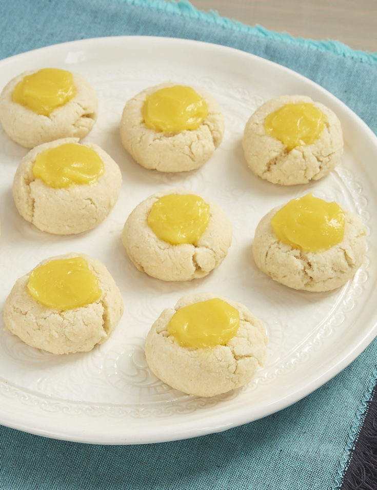 Sweet, tart lemon curd adds a delicious bite to these Lemon Thumbprint Cookies from Bake or Break.