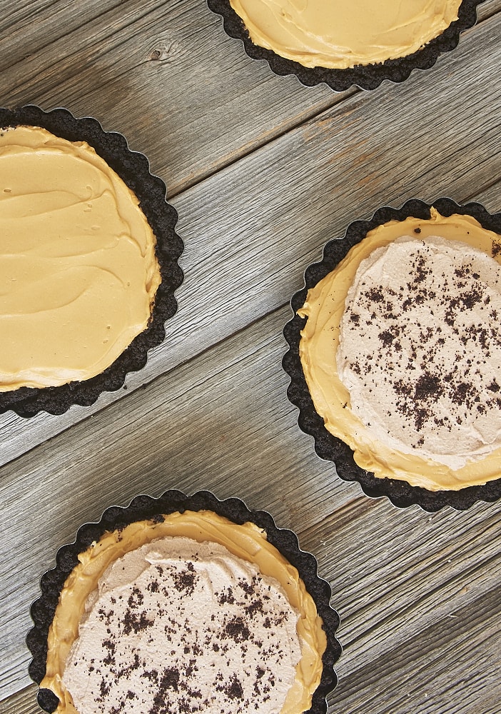 Dulce de leche, chocolate, and cheesecake are a tasty trio in this Dulce de Leche No-Bake Cheesecake! - Bake or Break
