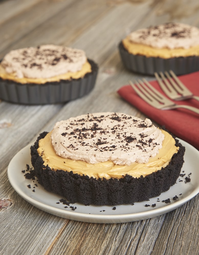 Dulce de leche, chocolate, and cheesecake are a tasty trio in this Dulce de Leche No-Bake Cheesecake! - Bake or Break