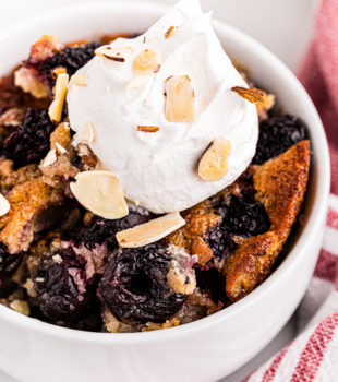 Top-down view of brown butter cherry cobbler in bowl