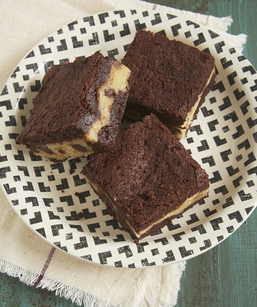 Chocolate Chip Cookie Stuffed Brownies on a black and white plate