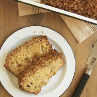 overhead view of slices of Peach Streusel Bread on a white plate