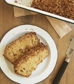 overhead view of slices of Peach Streusel Bread on a white plate