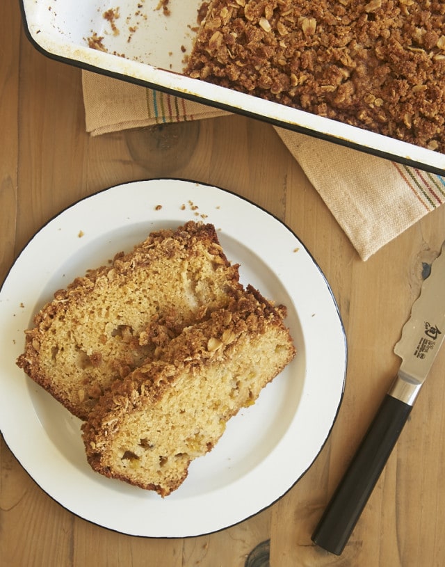 overhead view of slices of Peach Streusel Bread on a white plate